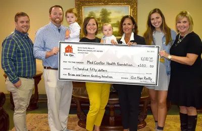 Give Hope Realty MCH Foundation check presentation 2019